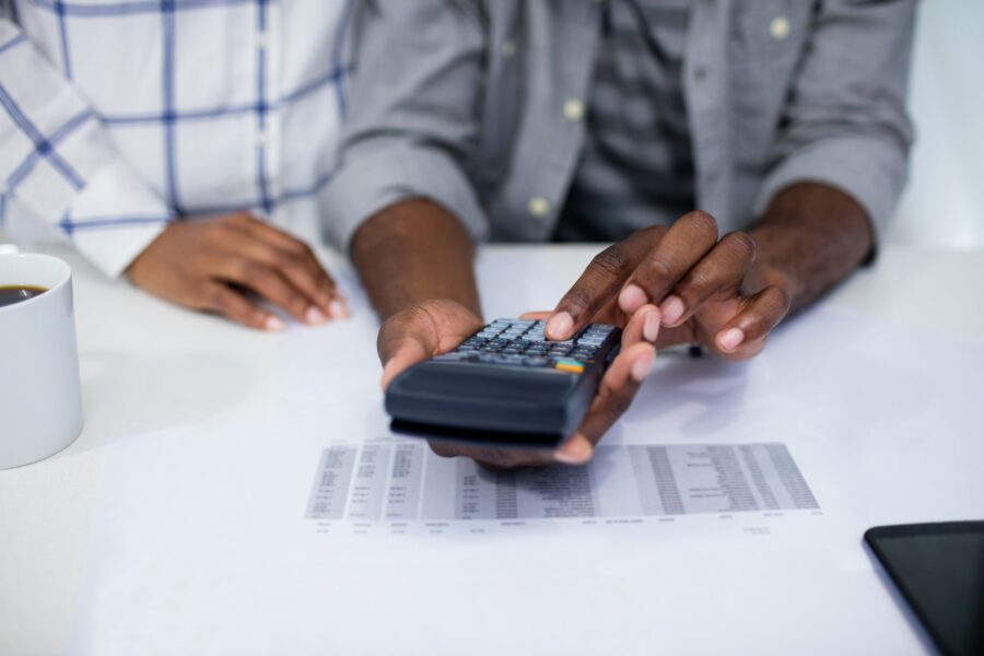 Man using a calculator